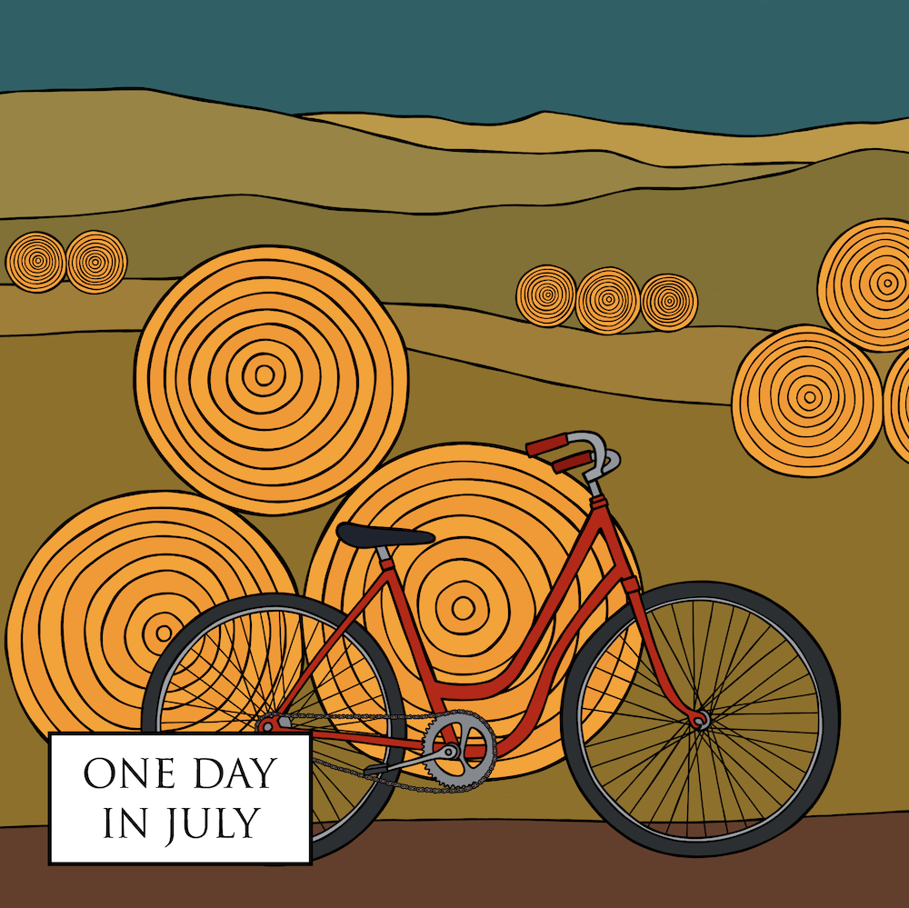 Bicycle leaning on a stack of hay bails, with hay bails and mountains in the background.